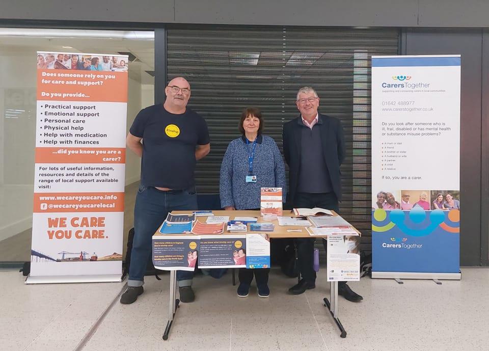 Carers Week Stall Cleveland Centre, John (Kinship), Sue (Middlesbrough and Stockton Mind), Mike (Middlesbrough Council).