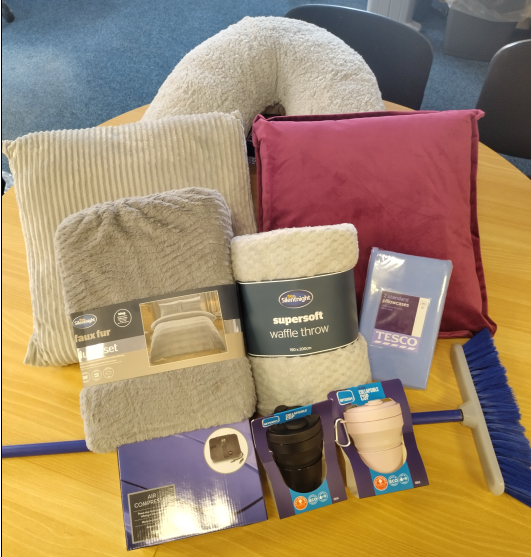 Image of various items including cushions, blankets and cups