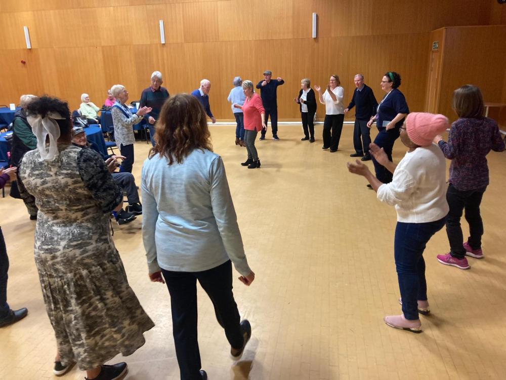 people living with dementia and carers dancing