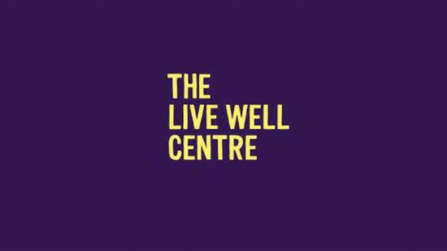 The Live Well Logo on purple background