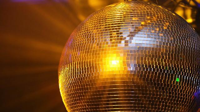 Disco ball with yellow/ orange light reflection