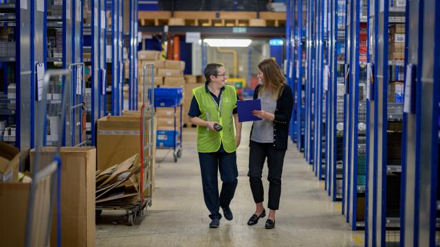 Two people in warehouse