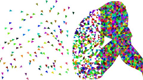 lady sat with head in hands with parts flying away from her