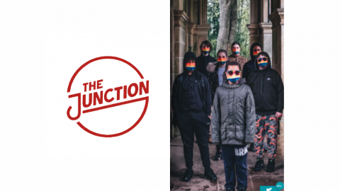 The Junction logo and image of 7 young carers involved in sharing their stories with rainbow facemasks