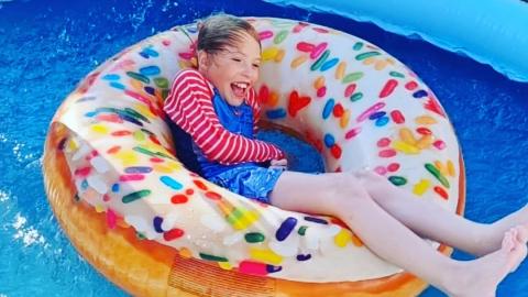 Bobby having fun in an inflatable donut in his garden paddling pool