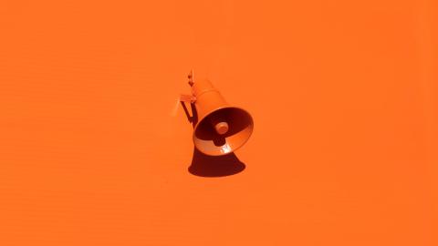 Orange background with orange megaphone