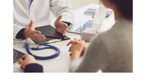 doctor talking to patient and family member