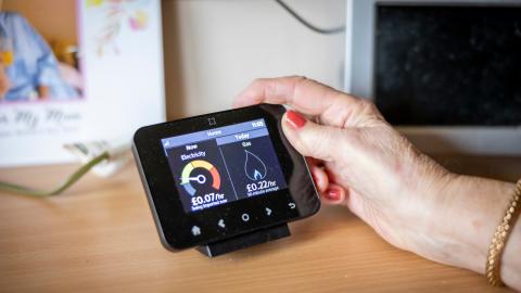 woman checking smart meter